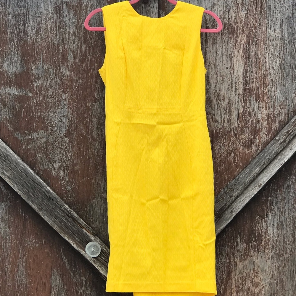 Like new Calvin Klein sheath dress in yellow.